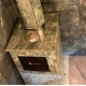 Печь Анапа М2 в трехстороннем кожухе из камня Пироксенит с открытым верхом
