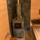 Печь Анапа М2 в трехстороннем кожухе из камня Пироксенит с открытым верхом